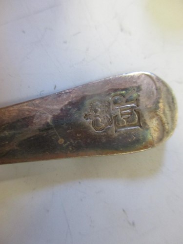 Lot 228 - A Russian enamel silver tea spoon together...