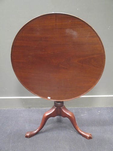 Lot 591 - A 19th century mahogany tilt top tripod table...