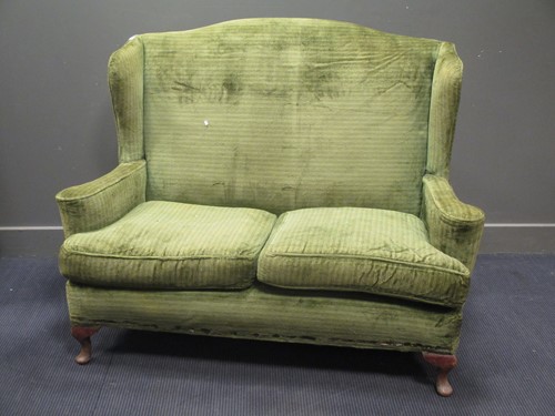 Lot 510 - An early 20th century green upholstered two...