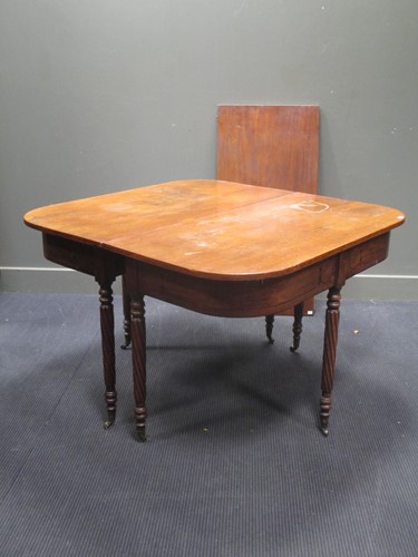 Lot 501 - A late Regency mahogany D-end dining table...