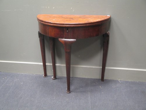 Lot 613 - A mid-18th century mahogany circular fold over...