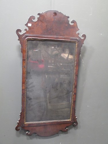 Lot 524 - A George III style walnut fret carved wall...