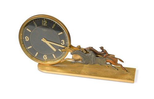 Lot 119 - Gubelin, a 1930s gilt metal horse racing trophy mantle clock