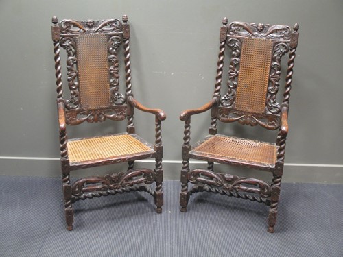 Lot 456 - A pair of Charles II walnut open arm chairs,...