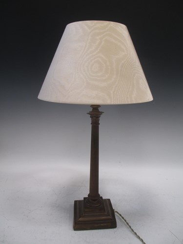 Lot 620 - A brass Corinthian column lamp and cream shade,...