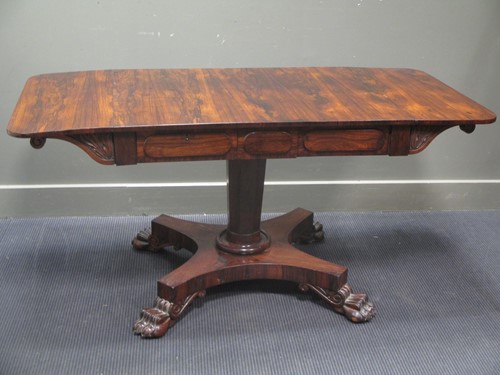 Lot 530 - A William IV rosewood sofa table on lion paw...