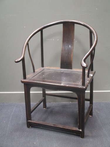 Lot 513 - A Chinese hard wood hoop back arm chair