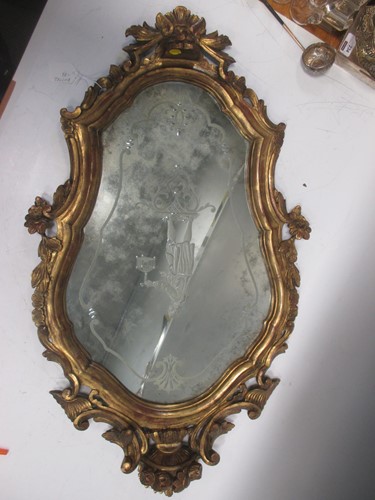 Lot 628 - A gilt wood wall mirror in the 18th century...