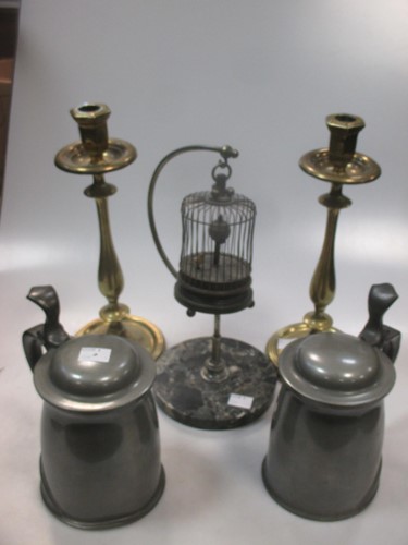 Lot 242 - A pair of late 19th century brass candlesticks,...