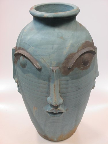 Lot 273 - A modern ceramic vase with moulded facial...