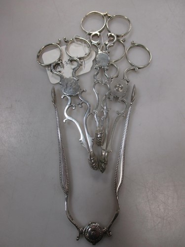 Lot 446 - 3 pairs of silver tea tongs and a pair of...
