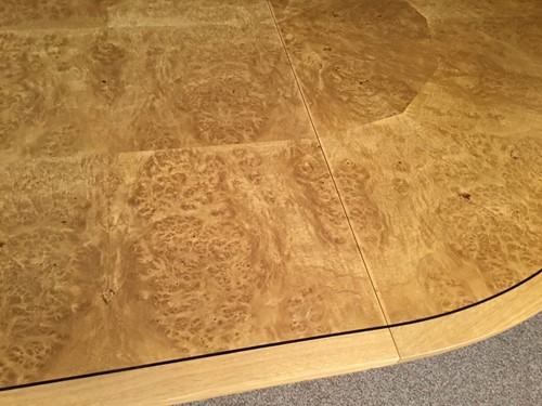 Lot 380 - A pale oak and birds eye maple extending dining table by David Linley