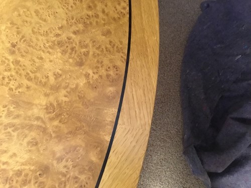 Lot 380 - A pale oak and birds eye maple extending dining table by David Linley