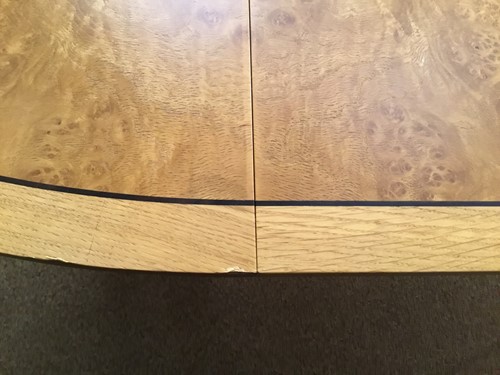Lot 380 - A pale oak and birds eye maple extending dining table by David Linley