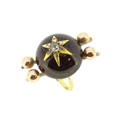 Lot 65 - A Victorian cabochon garnet and diamond ring