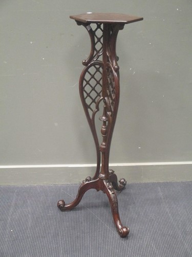 Lot 335 - A rococo style mahogany torchere