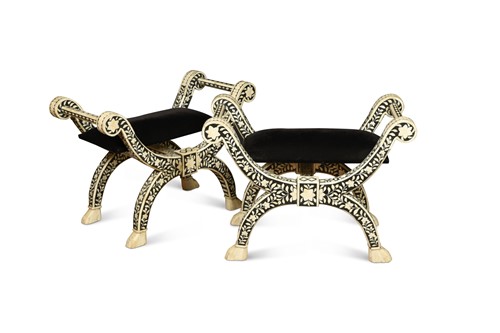 Lot 384 - A pair of North African bone and ebony X framed stools, 20th century