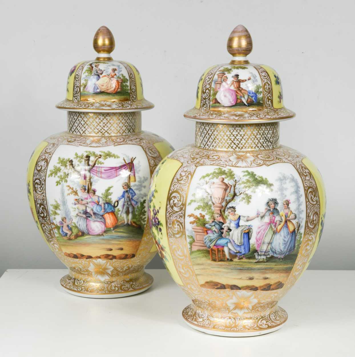 Lot 43 - A pair of Dresden vases and covers, 19th / 20th century