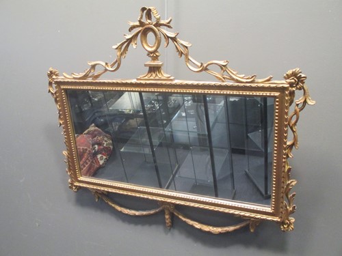 Lot 553 - A giltwood mirror with rectangular plate, in the Regency style