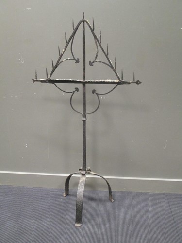Lot 471 - A 17th/18th century wrought-iron church candelabra