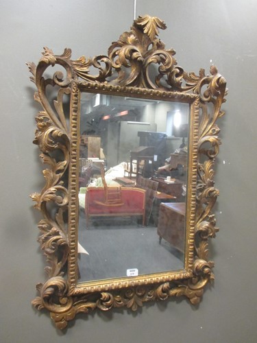 Lot 379 - An 18th century style Florentine giltwood wall mirror