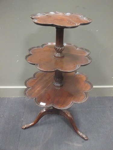 Lot 469 - A mahogany three-tier dumb waiter