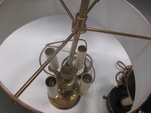 Lot 120 - An engraved lacquered-brass four-branch...