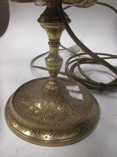 Lot 120 - An engraved lacquered-brass four-branch...