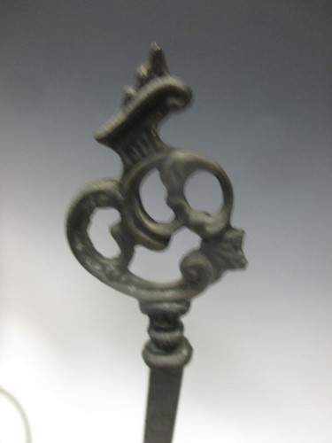 Lot 120 - An engraved lacquered-brass four-branch...