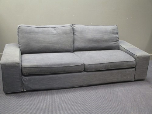 Lot 583 - A contemporary grey upholstered three seater...