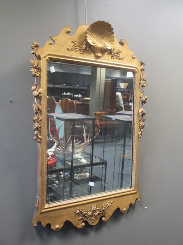 Lot 498 - A George III reproduction gilt wall mirror,...