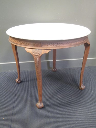 Lot 582 - A Continental carved oak occasional table,...