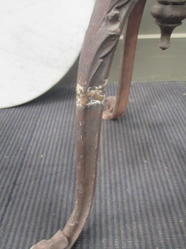 Lot 747 - A Victorian style cast iron base garden table...