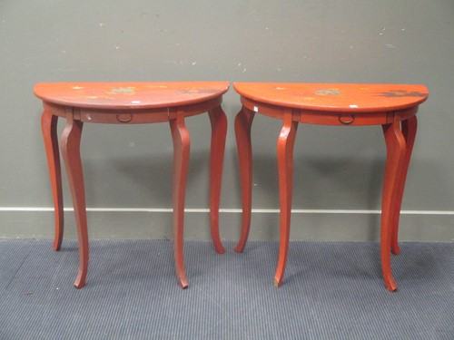 Lot 564 - A pair of red japanned bow fronted bedside or...