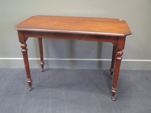 Lot 765 - A mahogany canted rectangular side table on...