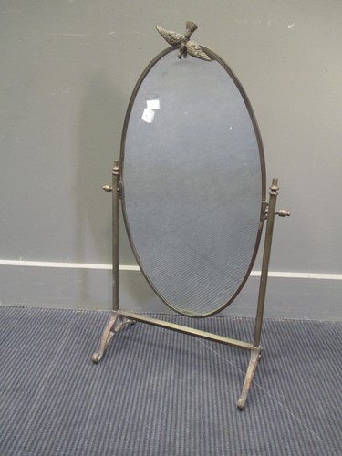 Lot 691 - A brass framed oval dressing table mirror,...