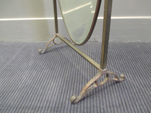 Lot 691 - A brass framed oval dressing table mirror,...