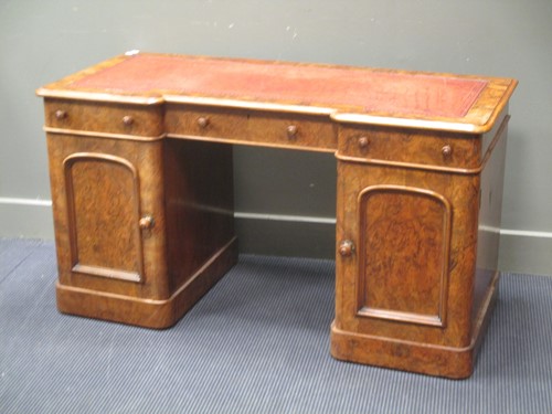 Lot 705 - A Victorian walnut kneehole desk with inverted...