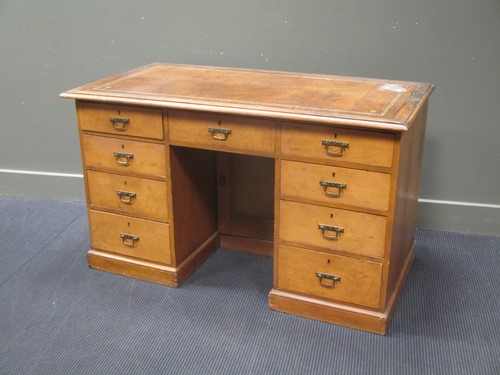 Lot 774 - A pine pedestal desk, with leather top over...