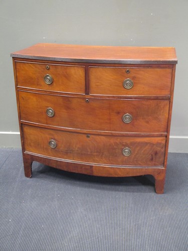 Lot 773 - A mahogany bowfronted chest of two short and...