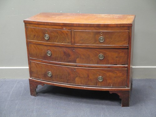 Lot 769 - A mahogany bowfronted chest of two short and...