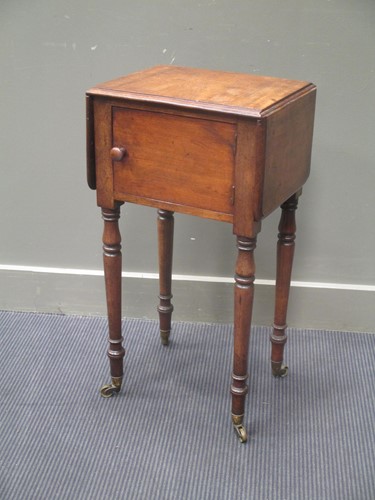 Lot 786 - A mahogany drop leaf night table, on turned...