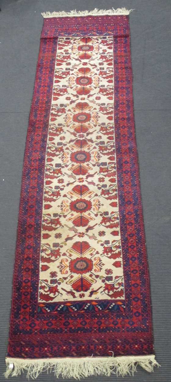 Lot 900 - A Beluchi style runner, modern 310 x 79cm