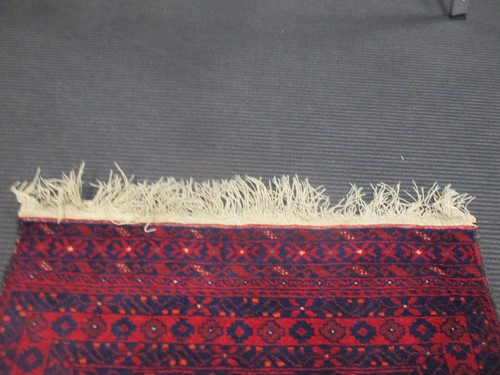 Lot 900 - A Beluchi style runner, modern 310 x 79cm