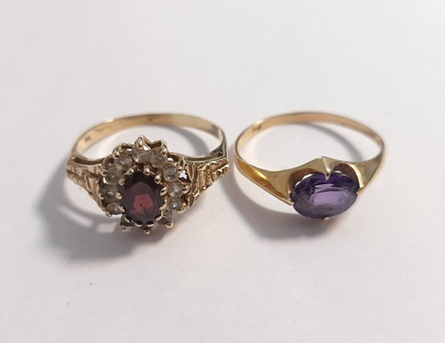 Lot 400 - A garnet and CZ cluster ring, along with an...