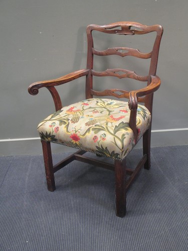 Lot 767 - A George III elbow chair of wide proportions...