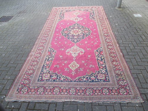 Lot 599 - A red ground wool Kelly rug, 402 x 202cm