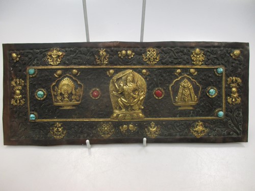 Lot 45 - A possibly Tibetan rectangular metal embossed...