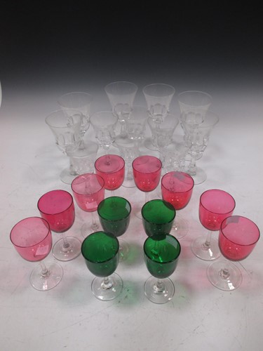 Lot 220 - Eight cranberry glasses, four in green, and...
