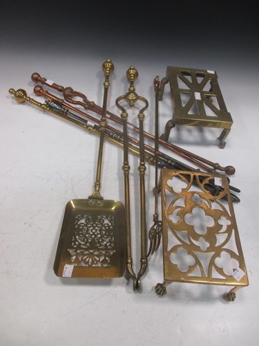 Lot 803 - Three matching brass fire irons, two copper...